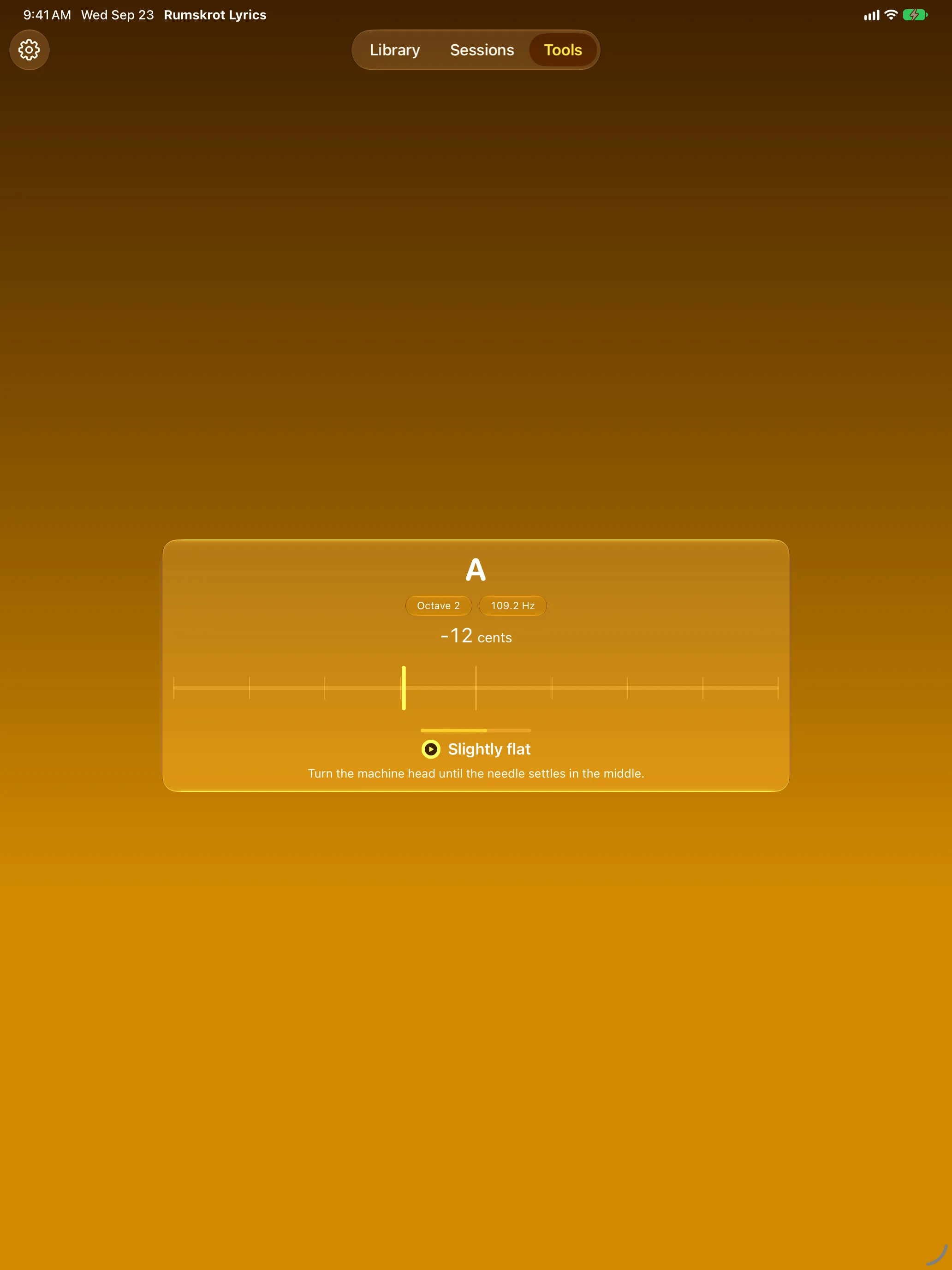 Chromatic tuner on iPad showing a note slightly flat